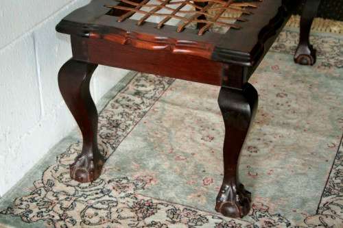 A stunning and well-made vintage solid imbuia ball & claw riempie foot stool with leather riempies