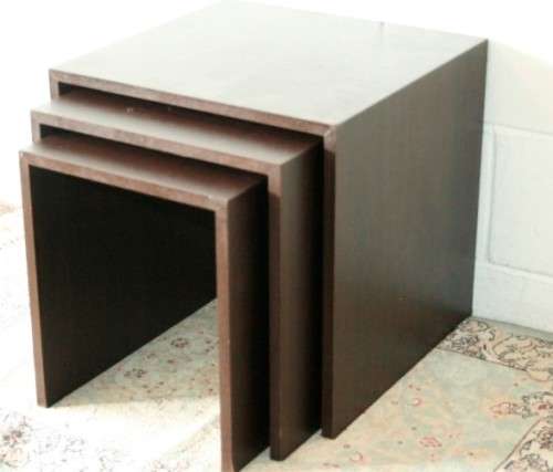 A fabulous set of "modern" styled stacking/ nesting tables, stunning in any living area in the home