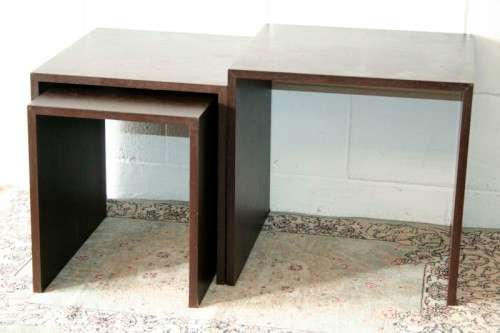 A fabulous set of "modern" styled stacking/ nesting tables, stunning in any living area in the home