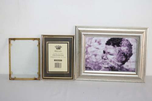 Three beautiful assorted metal free standing photo frames including an antique frame