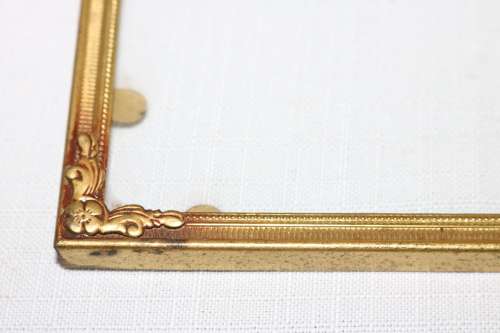 Three beautiful assorted metal free standing photo frames including an antique frame