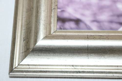 Three beautiful assorted metal free standing photo frames including an antique frame