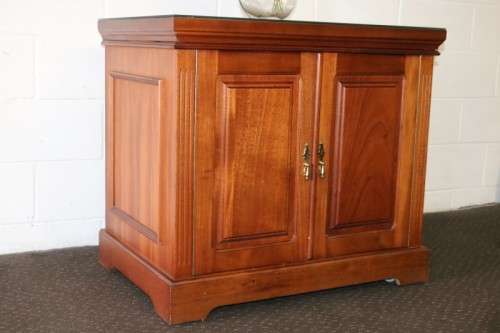 A wonderful Mahogany mini bar cabinet with shelves inside and a removable glass top on castors
