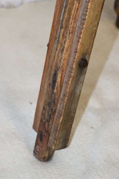 A fantastic antique metal and wood surveyor tripod in good condition for its impressive age