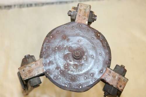 A fantastic antique metal and wood surveyor tripod in good condition for its impressive age