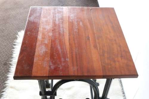 An amazing vintage cast iron sewing table with a wooden top - well made and very heavy!