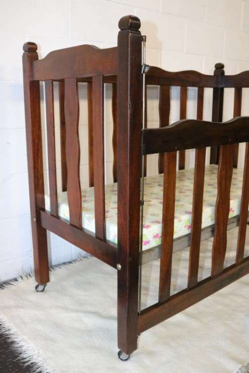 An awesome vintage solid Imbuia baby's cot on its original castors - perfect for nursery - RS17Sale