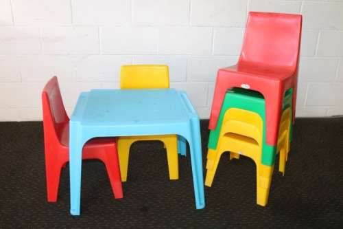 A set of 7x kids multi-coloured plastic chairs & a blue kids table; perfect for kids play room