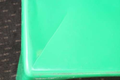 A set of 7x kids multi-coloured plastic chairs & a blue kids table; perfect for kids play room