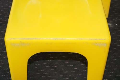 A set of 7x kids multi-coloured plastic chairs & a blue kids table; perfect for kids play room