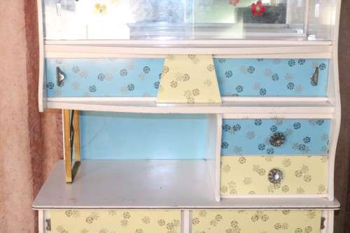 A fantastic Art Deco Hoosier kitchen cabinet w/ loads of cupboard space & a built in clock