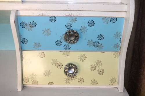 A fantastic Art Deco Hoosier kitchen cabinet w/ loads of cupboard space & a built in clock