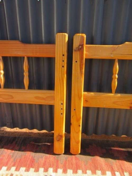 **RS17** Two natural pine spindle "single bed" size headboards in good condition. Bid/headboard