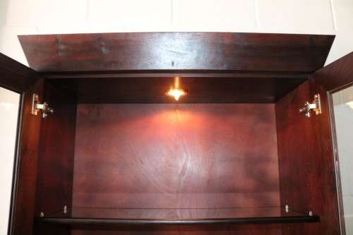 A magnificent Weylandts "Havana" double-door bookcase with glass shelves and a built-in light - WOW