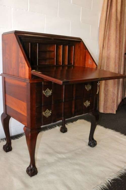A fantastic antique (c.1935) Imbuia ball & claw fall-top writing bureau with two large drawers