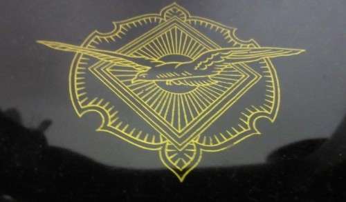 An incredible vintage (1930) singer "treadle" sewing machine in its cabinet in wonderful condition