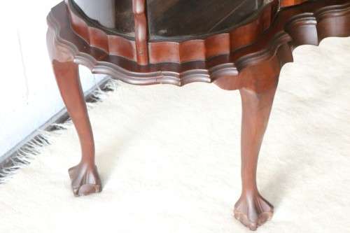 A beautiful vintage "curved glass" ball and claw display cabinet w scalloped edges & glass shelves