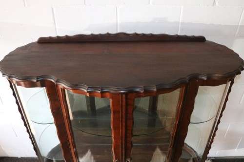 A beautiful vintage "curved glass" ball and claw display cabinet w scalloped edges & glass shelves