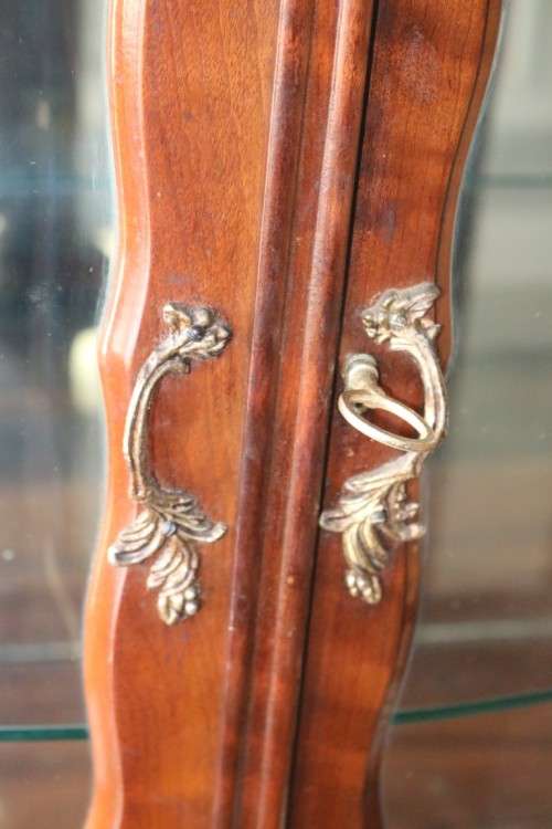 A beautiful vintage "curved glass" ball and claw display cabinet w scalloped edges & glass shelves