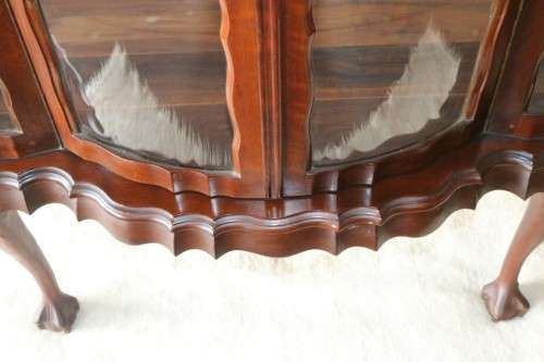 A beautiful vintage "curved glass" ball and claw display cabinet w scalloped edges & glass shelves