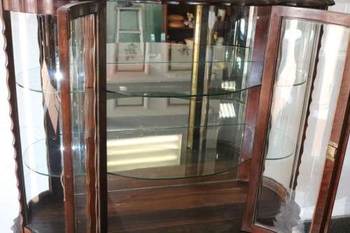 A beautiful vintage "curved glass" ball and claw display cabinet w scalloped edges & glass shelves