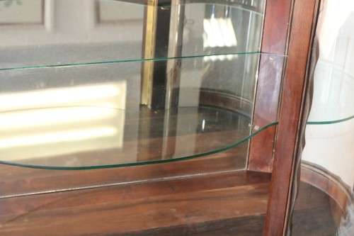 A beautiful vintage "curved glass" ball and claw display cabinet w scalloped edges & glass shelves