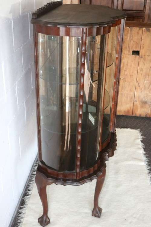 A beautiful vintage "curved glass" ball and claw display cabinet w scalloped edges & glass shelves