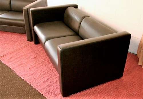 An awesome and stylish black bonded leather 2-seater "Tuxedo" couch in great condition