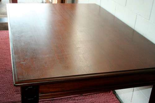A stunning mahogany 6 to 8-seater dining table with stylish modern lines in excellent condition