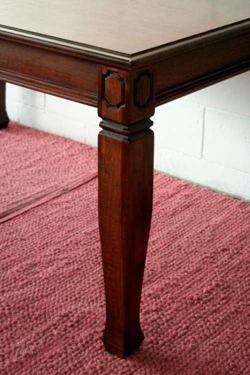 A stunning mahogany 6 to 8-seater dining table with stylish modern lines in excellent condition