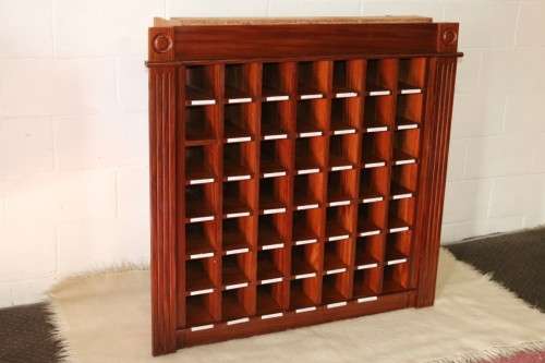 An awesome 49 bottle (floor cabinet) wine rack with individual wine bottle slots and sections