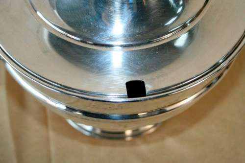 An exquisite vintage "EMESS" silver plated tureen with a slotted lid and beautiful ornate handles