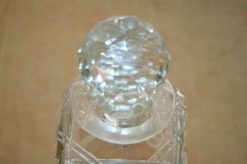 A beautiful classic ornate lead cut-crystal whiskey/ brandy decanter with a cut-crystal stopper