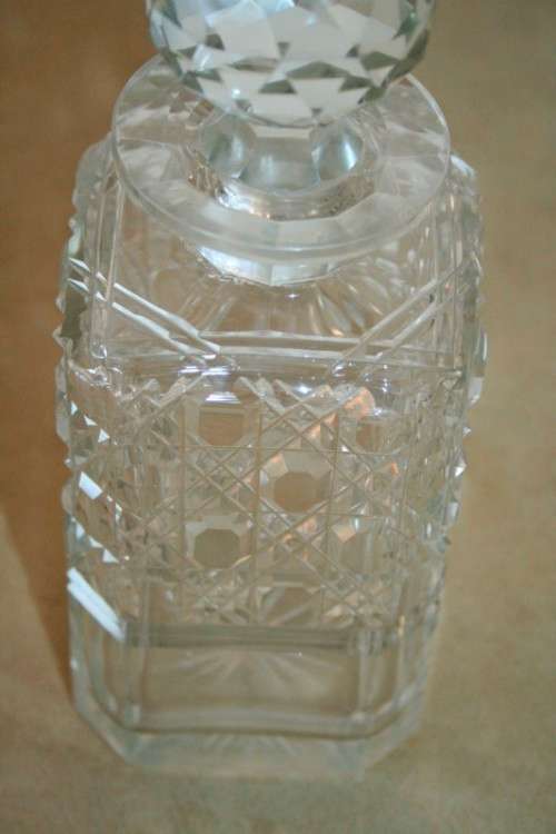 A beautiful classic ornate lead cut-crystal whiskey/ brandy decanter with a cut-crystal stopper