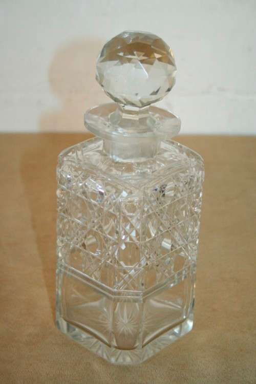 A beautiful classic ornate lead cut-crystal whiskey/ brandy decanter with a cut-crystal stopper