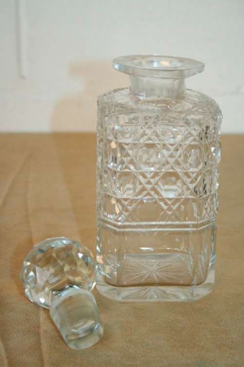 A beautiful classic ornate lead cut-crystal whiskey/ brandy decanter with a cut-crystal stopper