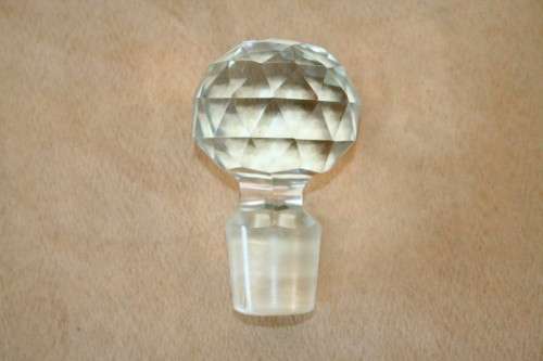 A beautiful classic ornate lead cut-crystal whiskey/ brandy decanter with a cut-crystal stopper