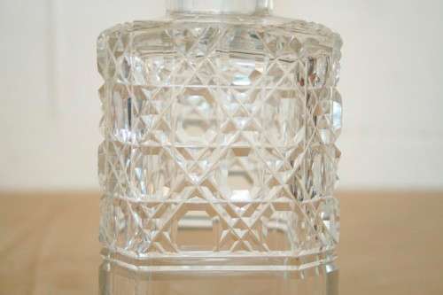 A beautiful classic ornate lead cut-crystal whiskey/ brandy decanter with a cut-crystal stopper