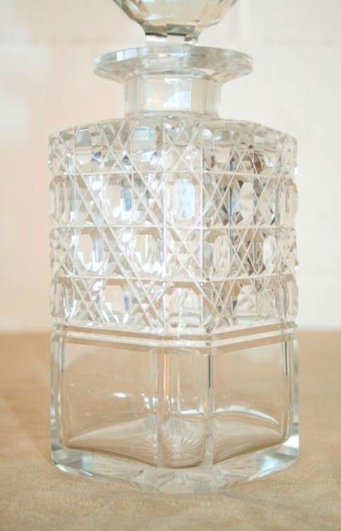 A beautiful classic ornate lead cut-crystal whiskey/ brandy decanter with a cut-crystal stopper