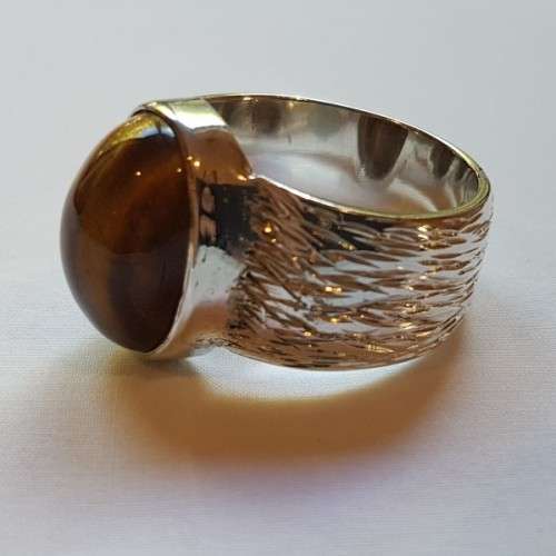 An exquisite vintage "Birks of Canada" sterling silver ladies ring w/ a large oval Tiger's Eye stone