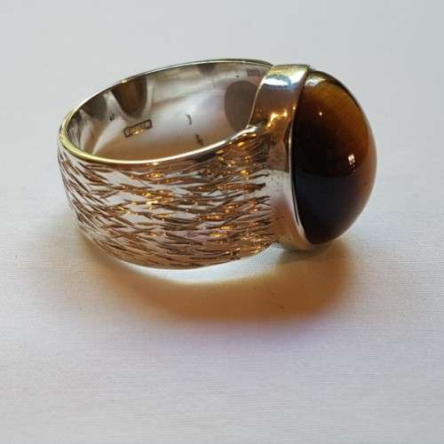 An exquisite vintage "Birks of Canada" sterling silver ladies ring w/ a large oval Tiger's Eye stone