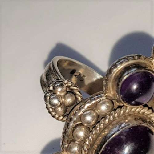 A truly spectacular Art Nouveau styled ladies ring with an array of beautiful round Amethyst stones