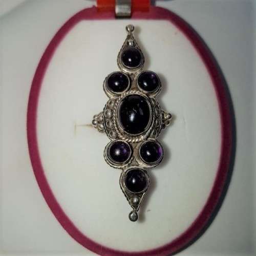 A truly spectacular Art Nouveau styled ladies ring with an array of beautiful round Amethyst stones