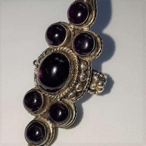 A truly spectacular Art Nouveau styled ladies ring with an array of beautiful round Amethyst stones