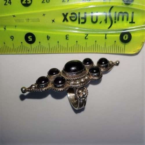 A truly spectacular Art Nouveau styled ladies ring with an array of beautiful round Amethyst stones