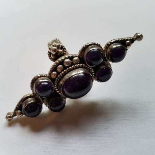 A truly spectacular Art Nouveau styled ladies ring with an array of beautiful round Amethyst stones