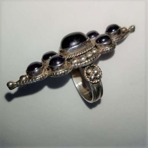 A truly spectacular Art Nouveau styled ladies ring with an array of beautiful round Amethyst stones