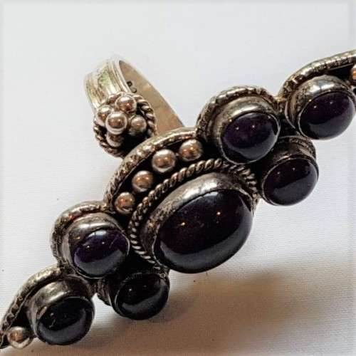 A truly spectacular Art Nouveau styled ladies ring with an array of beautiful round Amethyst stones
