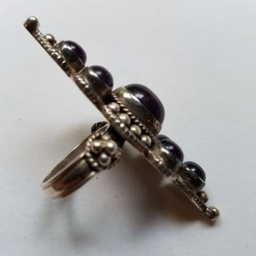 A truly spectacular Art Nouveau styled ladies ring with an array of beautiful round Amethyst stones