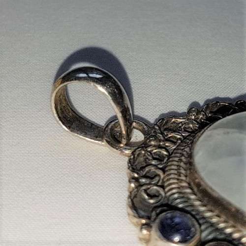 A wonderful vintage ladies sterling silver pendant with a large clear Topaz & 8 Amethyst stones